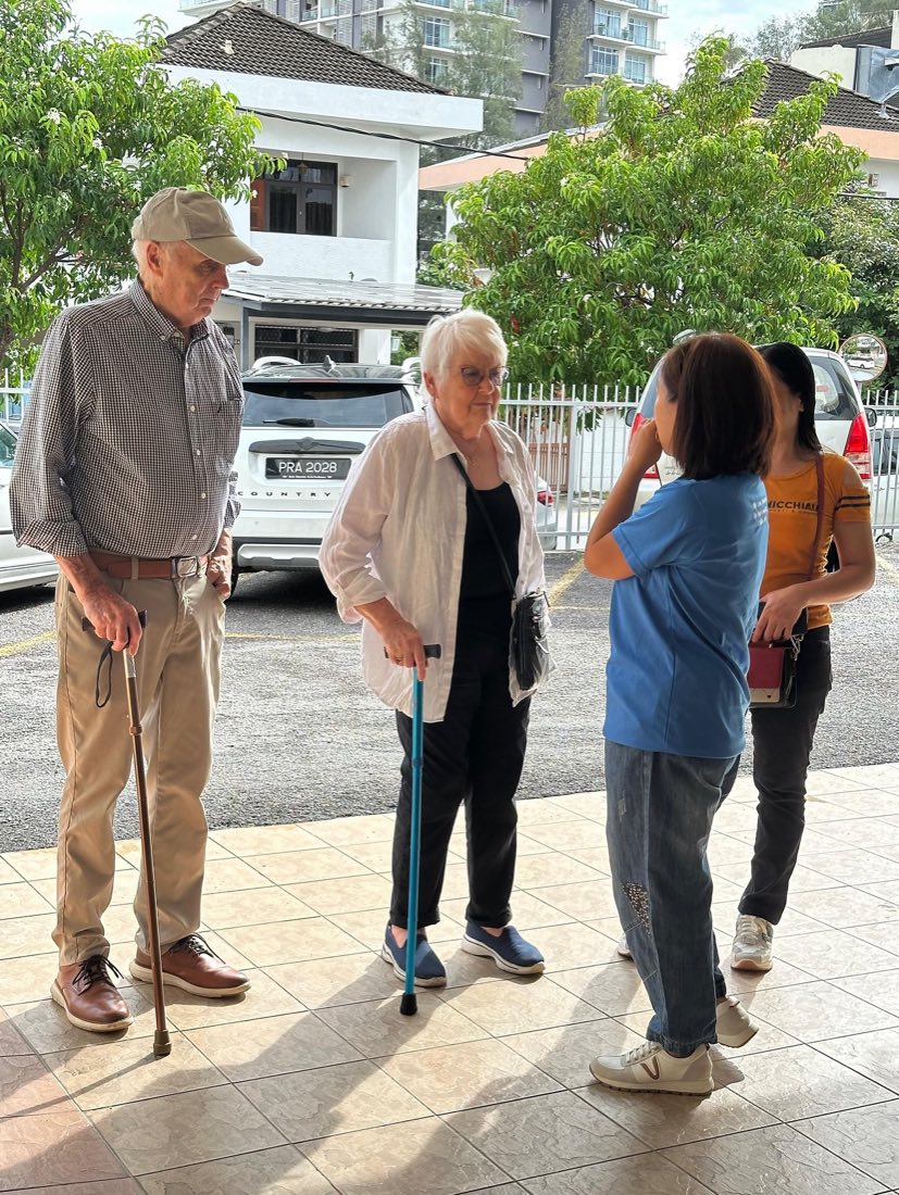 Visitors arriving at FPBC and being welcomed at the church entrance.